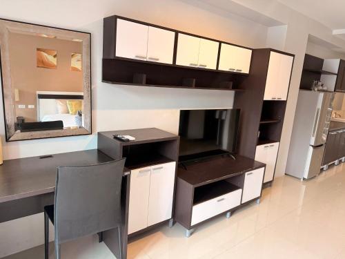 a room with a desk and a mirror in a room at Aonang Mountain View A1 in Ao Nang Beach
