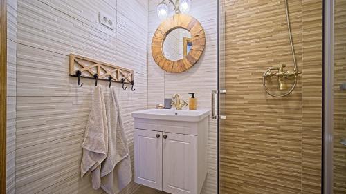 a bathroom with a sink and a shower at Villa Debelo Brdo by Villas Guide in Debelo Brdo