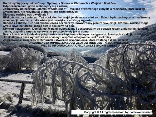 a picture of a sculpture of a bench in the snow at Domek w Chmurach II in Kicznia