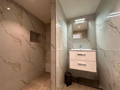 a bathroom with a sink and a mirror at Luxury House With 2 Private Independent Studios 120 m2 Near LEIDSEPLEIN CITY CENTRE AMSTERDAM - Paid Parking Possibilities Nearby in Amsterdam