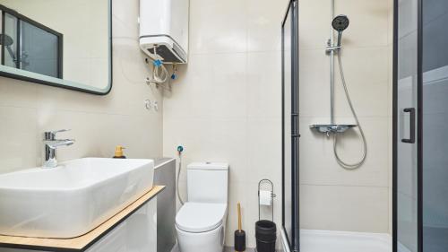 a bathroom with a sink and a shower at Villa AD Astra by Villas Guide in Sesvete