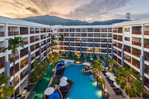 an aerial view of a resort with a lazy river at Deevana Plaza Phuket - SHA Extra Plus in Patong Beach