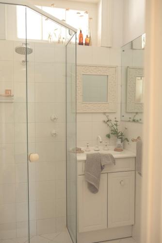 a bathroom with a shower and a sink at Way's Cottage in McLaren Vale