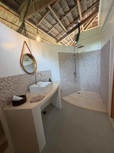 a bathroom with a sink and a mirror at Casa Ysatis in San Juan