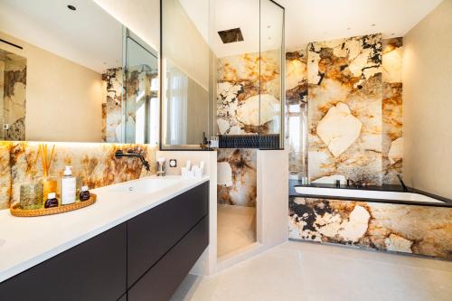 a bathroom with a sink and a shower at Villa Alexandra by Sweett in Cannes