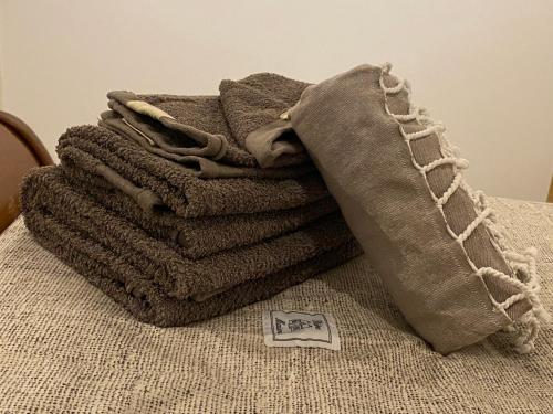 a pile of towels sitting on top of a table at A Soulas in Armous-et-Cau