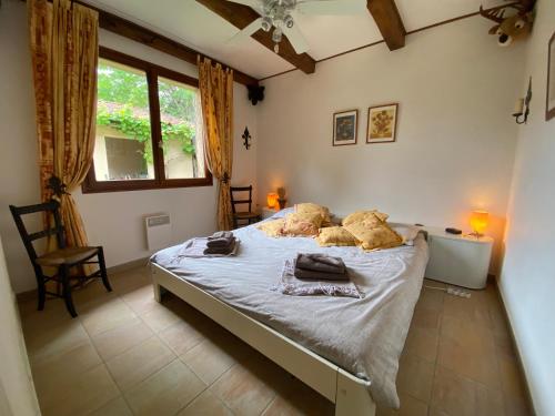 a bedroom with a bed with two teddy bears on it at A Soulas in Armous-et-Cau