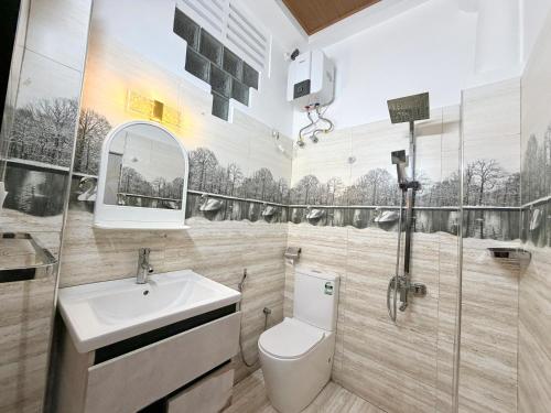 a bathroom with a toilet and a sink at Home Stay Residence - Near Airport in Negombo