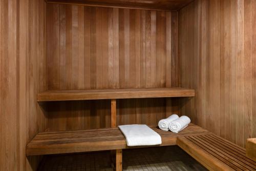 a sauna with two towels on a wooden shelf at Marriott's Maui Ocean Club - Molokai, Maui & Lanai Towers in Lahaina