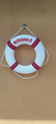 a life preserver hanging from a wall at Nirvana Pool Villa 2 in Nong Prue