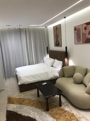 a hotel room with a bed and a couch at The view resort nabq in Sharm El Sheikh