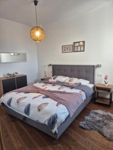 a bedroom with a large bed in a room at Luna chalet Zlatibor in Zlatibor