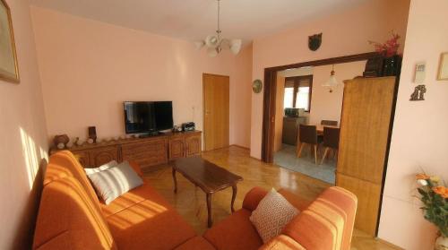 a living room with a couch and a table at Apartment Novi II in Kaštela