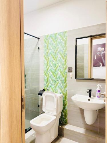 a bathroom with a toilet and a sink at Urban Homes-Two Bedroom Near JKIA Airport in Nairobi