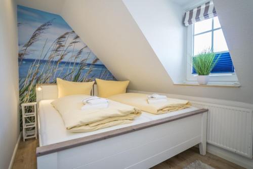 a bed in a room with a window at Lister Tor 11 in List