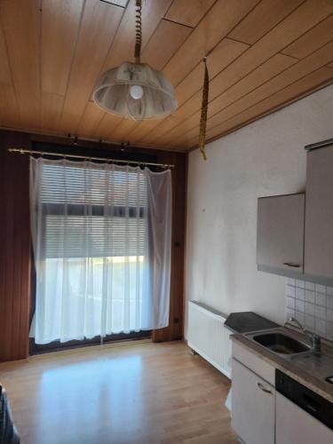 a kitchen with a window and a ceiling at Gröningen in Gröningen