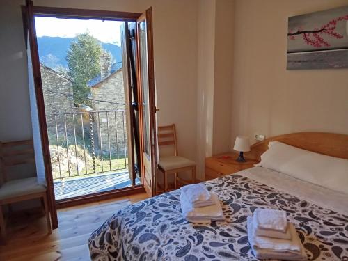 a bedroom with a bed and a large window at CR TESOL 6 SON - ALT ANEU in Son