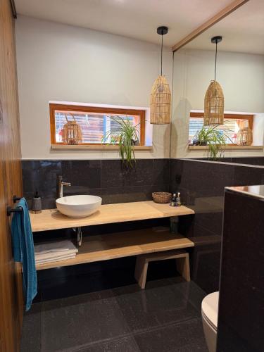a bathroom with a sink and a mirror at Za kovárnou in Zděchov
