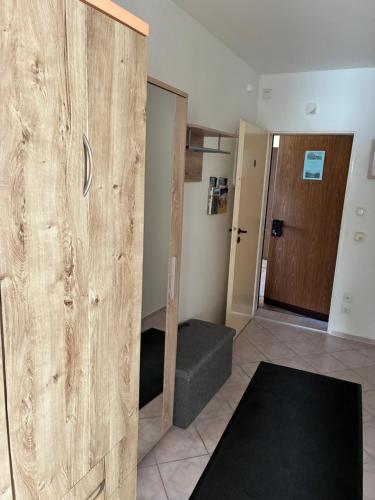 a room with a wooden sliding door and a stairway at Ferienwohnung in Misdroy/Ostsee in Międzyzdroje