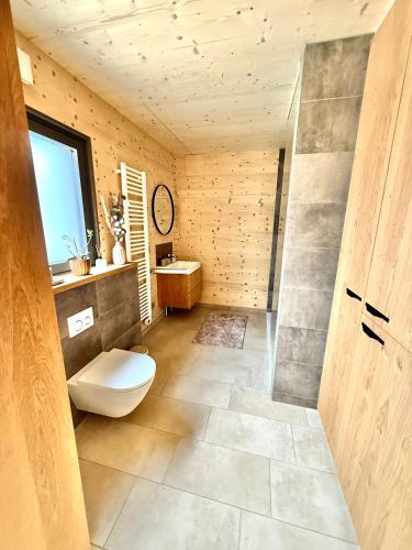 a bathroom with a toilet and a sink at Wohnen am Südhang in Amberg