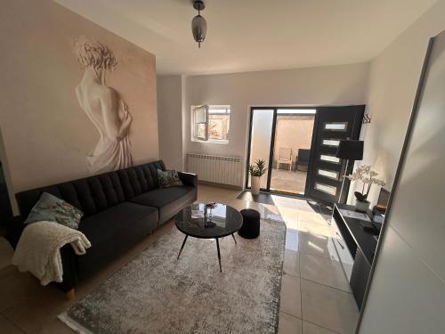 a living room with a couch and a table at Apartman 4N with free parking in Belgrade