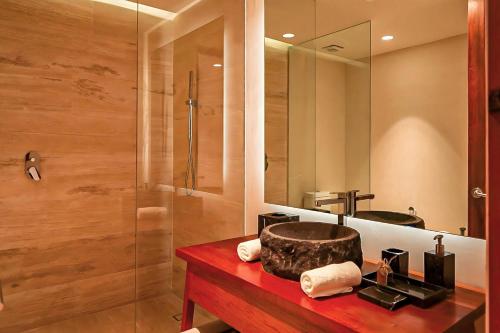 a bathroom with a sink and a shower at Bloom Tulum, Apartments by Marriott Bonvoy in Tulum