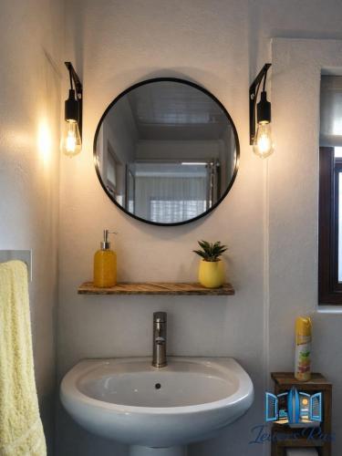 a bathroom with a sink and a mirror at Iewers Rus in Strand