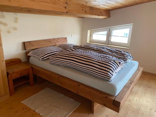a large bed in a room with a window at Ferienwohnung Red Horse Ranch in Eichstätt