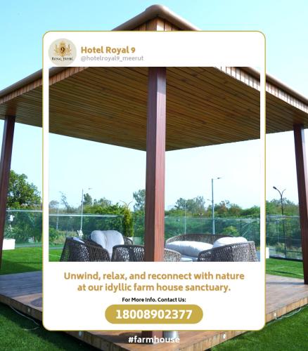 a sign for a pavilion with furniture in a park at Royal 9 Farm House in Meerut