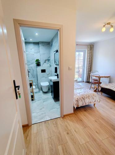 a bathroom with a sink and a toilet in a room at Agrokrysia in Krosʼtsenko