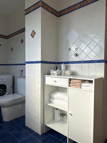 a bathroom with a white sink and a toilet at Apartment Kala in Varaždin