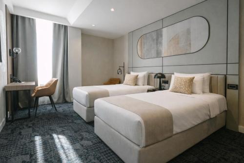 Postel nebo postele na pokoji v ubytování Hotel Hedonic