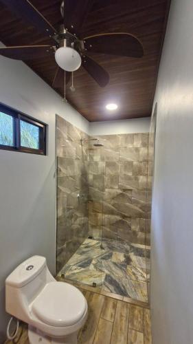 a bathroom with a toilet and a shower at House with a private pool in Ojochal