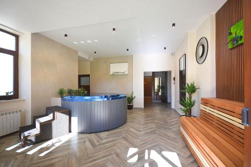 an office lobby with a reception desk and a waiting room at Hotel Moldavia in Slănic-Moldova