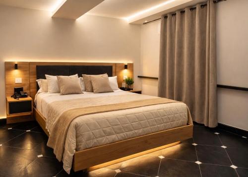 a bedroom with a large bed in a room at Molo di Alassio Luxury Room in Alassio