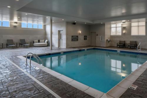 a large pool with blue water in a hotel room at Residence Inn by Marriott Montgomery Downtown in Montgomery