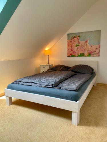 a bed sitting in a room with at Ferienwohnung Dümmerling in Hüde in Hüde