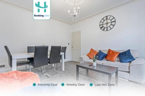 a living room with a couch and a table at 5BR House Perfect For Contractor Stays By Hyped Properties Short Term Rental Agency Wolverhampton in Wolverhampton