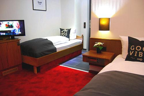 Ένα ή περισσότερα κρεβάτια σε δωμάτιο στο Parkhotel Bergheim