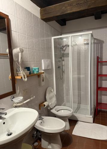 a bathroom with a shower and a toilet and a sink at Tenuta Del Varco in Varco Sabino