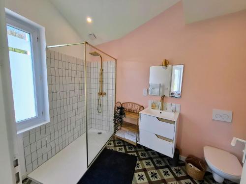 a bathroom with a shower and a sink and a toilet at Les Bords de l'Ouin - Mauléon - Proche PuyduFou - 4 personnes in Mauléon