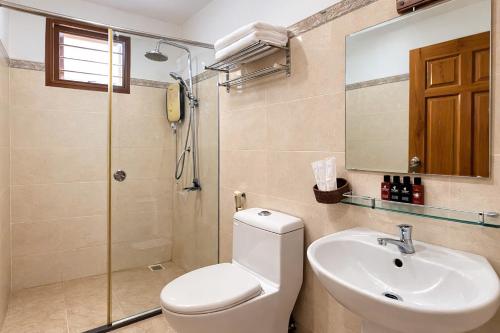 a bathroom with a toilet and a sink and a shower at FORTUNE HOTEL 2 LUCKY STAY Phu Quoc in Phú Quốc
