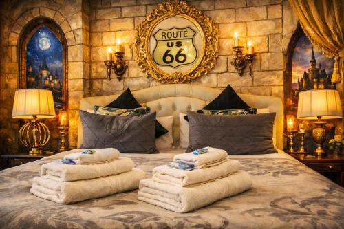 a pile of towels sitting on top of a bed at BB Naviglio Milano Centro in Milan