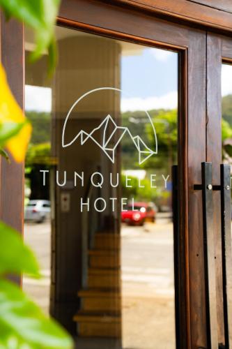 a sign in the window of a hotel at Tunqueley Hotel in San Martín de los Andes