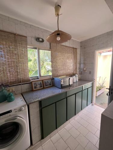 a kitchen with a washing machine on a counter at Carpe Diem Gonnet in Joaquín Gorina