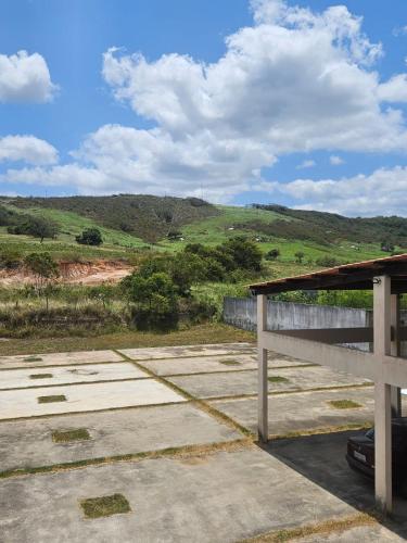 a view of a hill from a parking lot at Pousada Aconchego in Duas Estradas