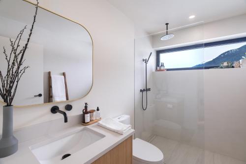 a bathroom with a sink and a shower at Spacious 2BR Retreat, Scenic Views, Modern & New in Whistler