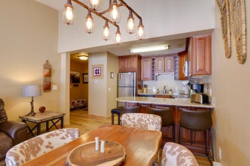 a kitchen and living room with a table and chairs at Walk to Copper Mountain Lifts Mtn-View Condo in Copper Mountain