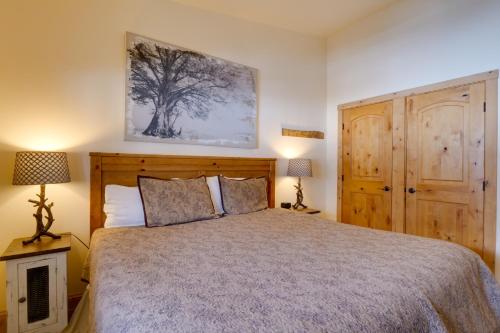 a bedroom with a bed with a wooden headboard at Walk to Copper Mountain Lifts Mtn-View Condo in Copper Mountain
