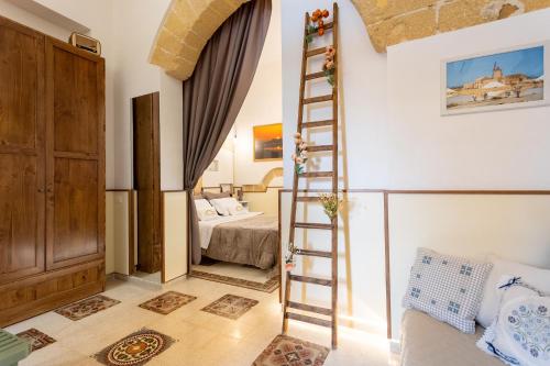 a room with a ladder leading to a bedroom at La Culla di Adeodata in Marsala